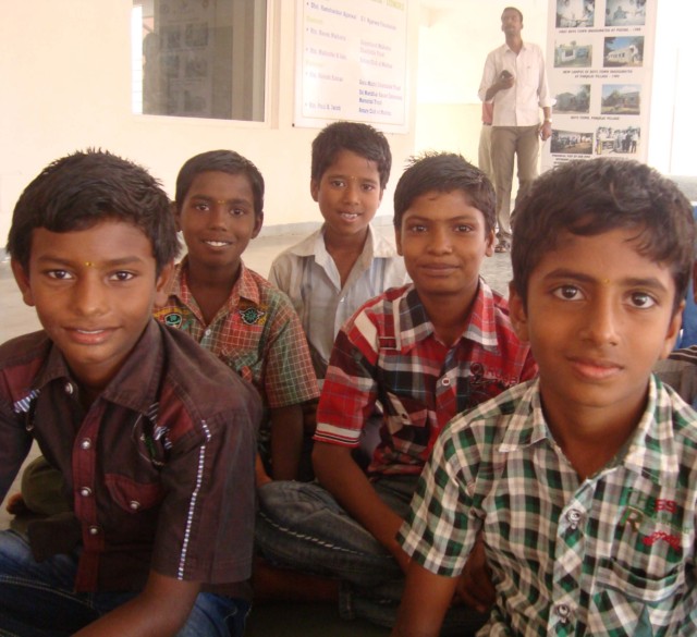 Photo of 5 boys at Gummidipoondi sitting cross legged on the floor