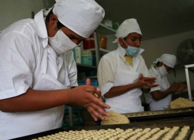 Photo of boys making biscuits in the JUCONI workshop